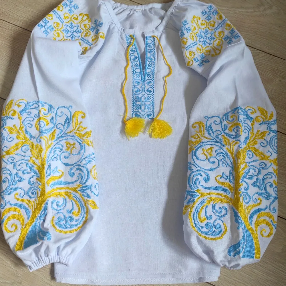 Children's embroidered blouse with yellow and blue embroidery
