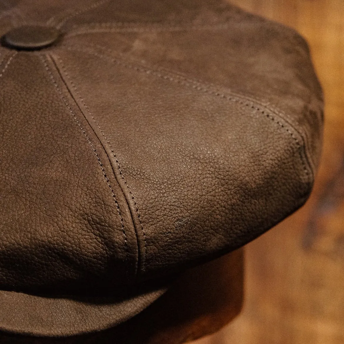 Eight Piece Brown Leather Newsboy Cap